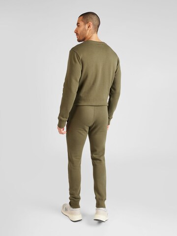 Tapered Pantaloni sportivi di AÉROPOSTALE in verde