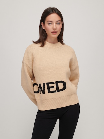 UNFOLLOWED x ABOUT YOU Pullover  'SIGNATURE' in Beige: predná strana