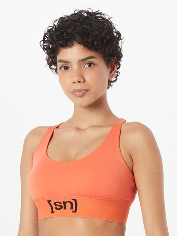 Bustino Reggiseno sportivo di super.natural in arancione: frontale