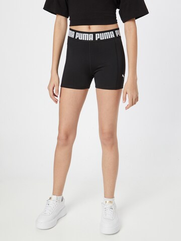 PUMA Skinny Workout Pants in Black: front