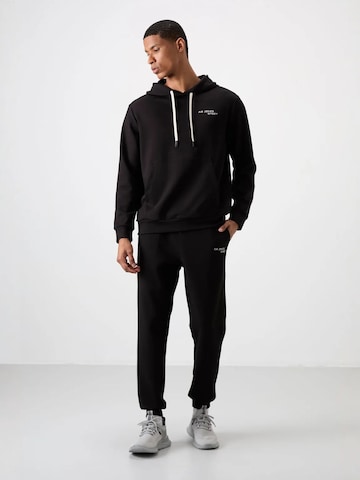Survêtement Tommy Life en noir : devant