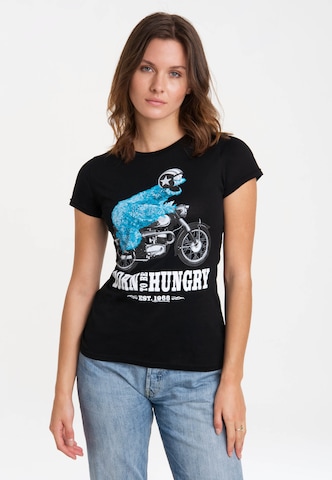 LOGOSHIRT Shirt 'Sesamstraße - Krümelmonster Motorrad' in Zwart: voorkant