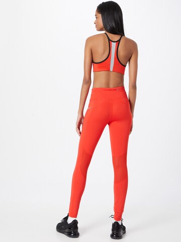 NIKE Skinny Workout Pants in Red