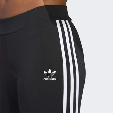 Evazați Leggings de la ADIDAS ORIGINALS pe negru