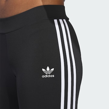 ADIDAS ORIGINALS Flared Leggings in Schwarz