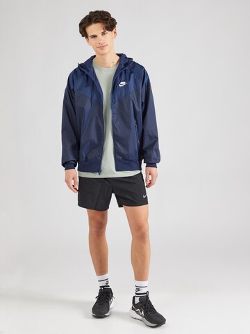 Nike SportswearPrijelazna jakna - plava boja