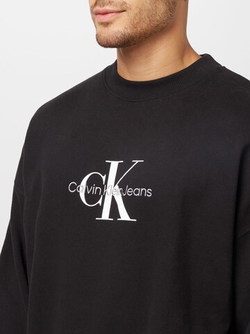 Calvin Klein Jeans كنزة رياضية بلون أسود