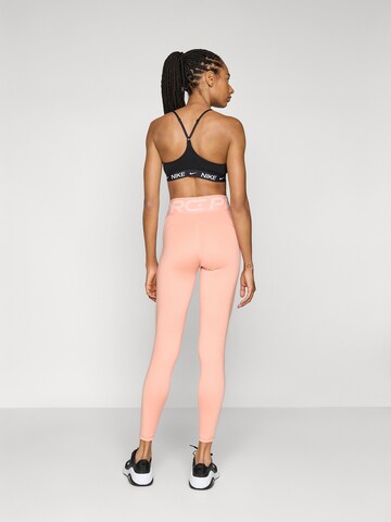 oranžinė NIKE Siauras Sportinės kelnės: galas