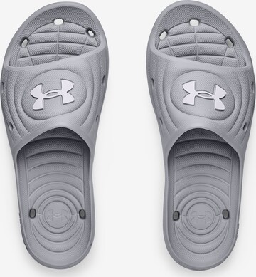 Claquettes / Tongs UNDER ARMOUR en gris