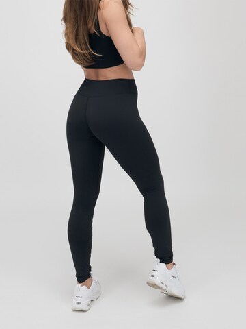 ABOUT YOU x VIAM Studio Skinny Leggings 'CAMILA' in Black: front