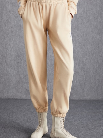 Grimelange Zúžený strih Nohavice - Béžová: predná strana