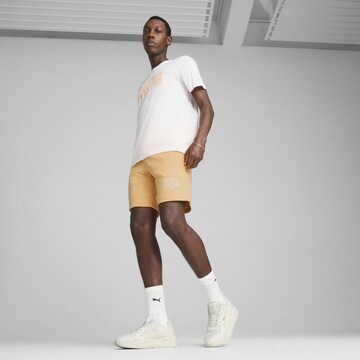 PUMA Regular Broek 'Class' in Oranje