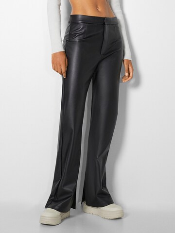 Bershka Flared Pants in Black: front