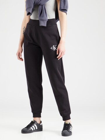 Calvin Klein Jeans - Tapered Pantalón en negro: frente