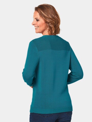 Goldner Pullover in Blau