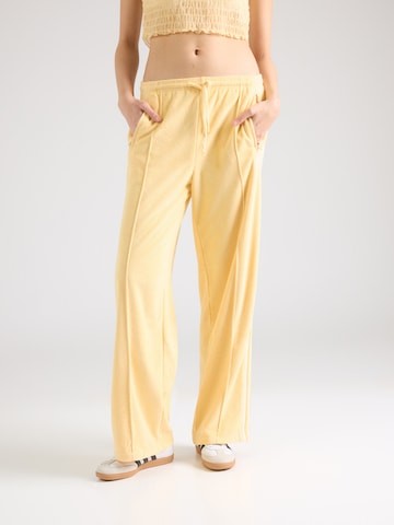 ADIDAS ORIGINALSLoosefit Hlače 'Firebird' - žuta boja: prednji dio