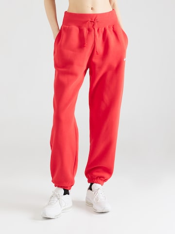 Nike Sportswear Zwężany krój Spodnie 'Phoenix Fleece' w kolorze czerwony: przód
