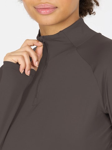 Athlecia Functioneel shirt 'Grina' in Bruin