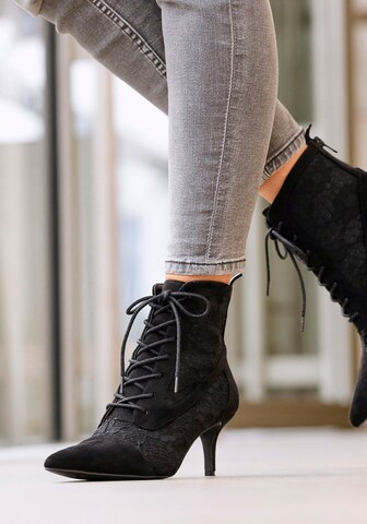 LASCANA Lace-up bootie in Black: front