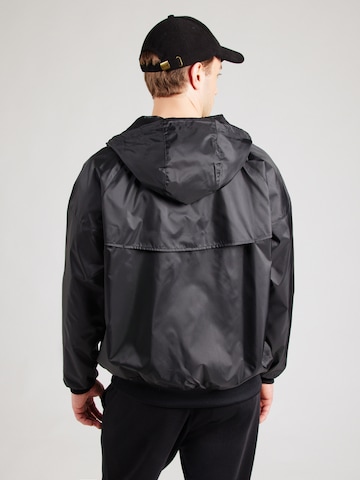 Geacă de primăvară-toamnă 'Heritage Essentials' de la Nike Sportswear pe negru