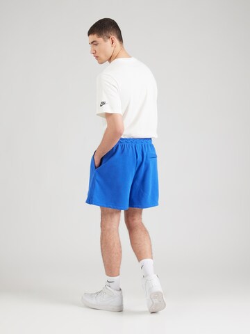 Loosefit Pantaloni 'CLUB' di Nike Sportswear in blu