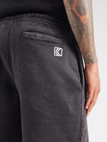 Karl Kani Loose fit Trousers in Black