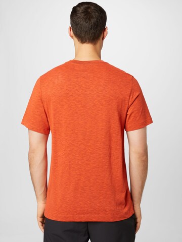 NIKE - Camiseta funcional en naranja