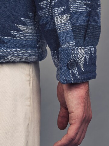 Next Tussenjas in Blauw