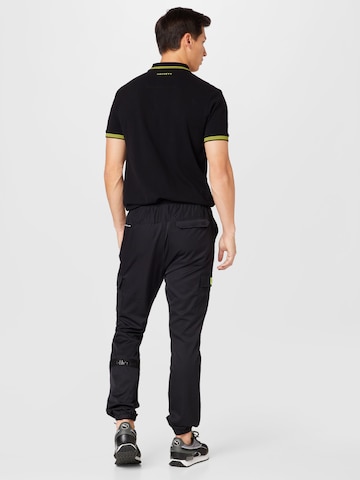 ELLESSE Regular Workout Pants 'Halios' in Black