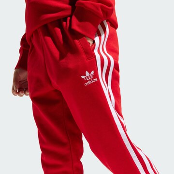 ADIDAS ORIGINALS - Ropa para correr 'Adicolor' en rojo