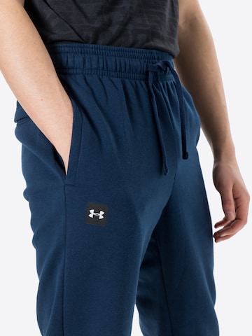 Effilé Pantalon de sport 'Rival' UNDER ARMOUR en bleu