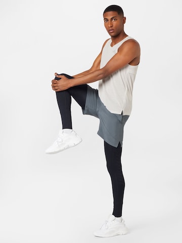 UNDER ARMOUR Skinny Sportbroek 'Speedpocket' in Zwart