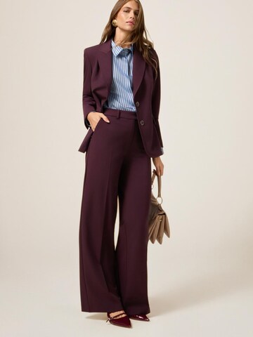 oltre Baggy Trousers in Red: front