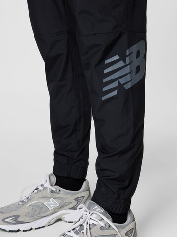 new balance - Tapered Calças de desporto 'Tenacity' em preto