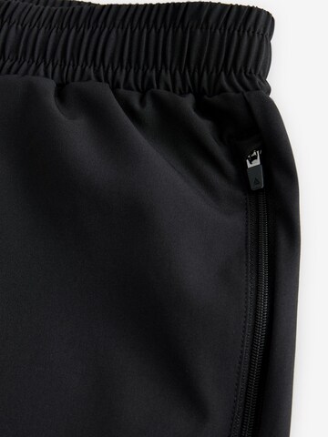 Next - Tapered Pantalón deportivo en negro