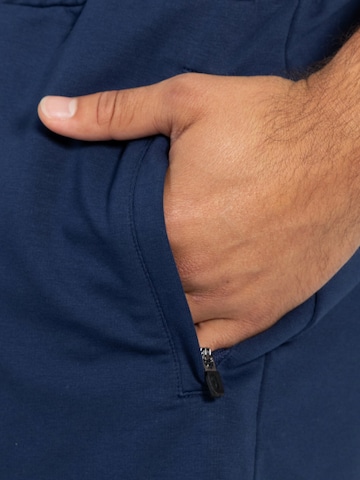Loosefit Pantalon de sport ' Edin ' Smilodox en bleu