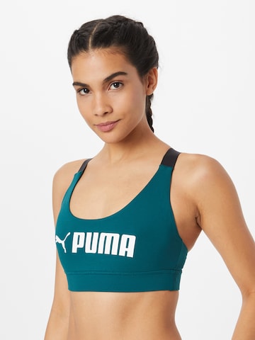 PUMA Bralette Sports Bra in Green: front