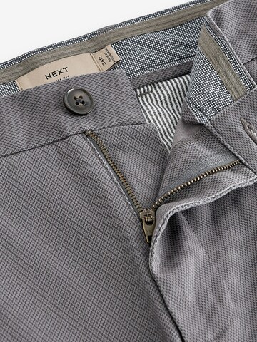 Slimfit Pantaloni chino di Next in grigio