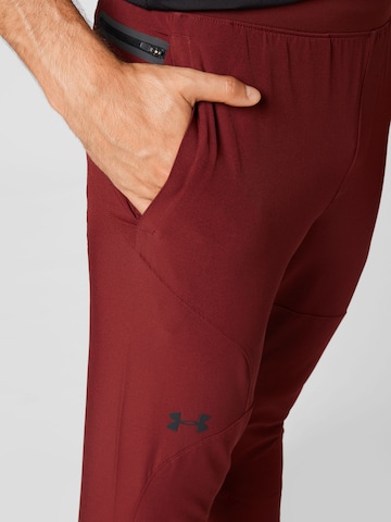 UNDER ARMOUR - Regular Calças de desporto 'UNSTOPPABLE' em vermelho