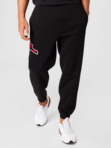 PUMA Tapered Sportbroek in Zwart: voorkant