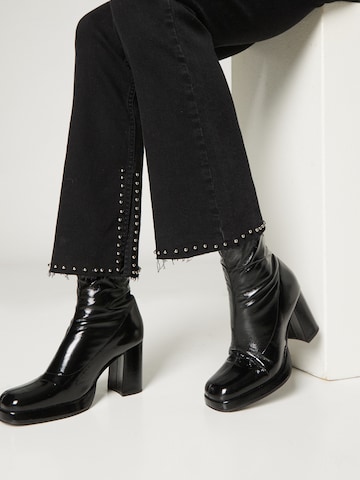 Guido Maria Kretschmer Women Boot cut Jeans 'Caja' in Black