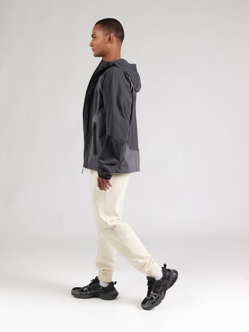 Nike Sportswear - Casaco funcionais 'Windrunner' em cinzento