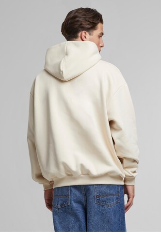 Karl Kani Collegepaita värissä beige