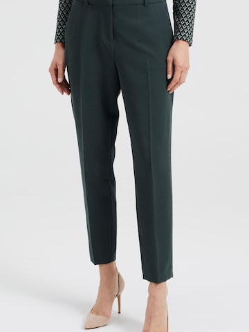 Coupe slim Pantalon à plis WE Fashion en vert : devant