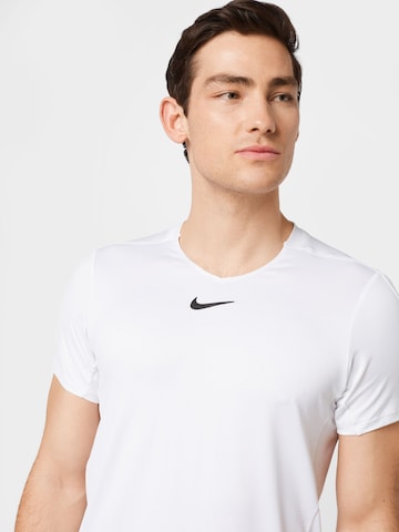 T-Shirt fonctionnel NIKE en blanc