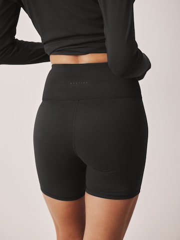 Skinny Pantalon de sport 'Active Balance' Next en noir