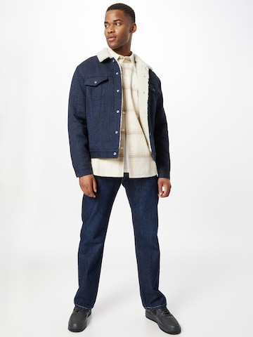 LEVI'S ® Between-season jacket 'Type 3 Sherpa Trucker' in Blue