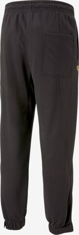 PUMA - Tapered Pantalón deportivo 'Gen.G' en negro