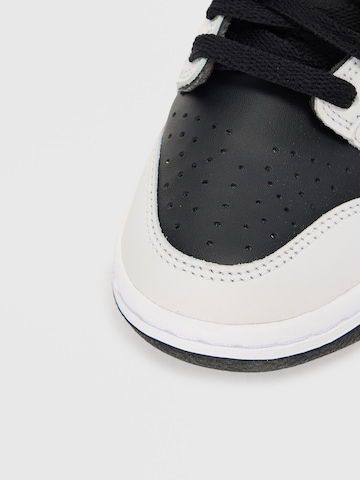 Baskets 'Dunk' Nike Sportswear en noir