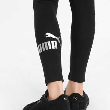 PUMA Skinny Leggingsit 'ESS+' värissä musta